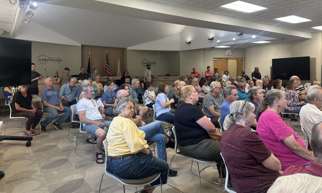 Standing-room-only Oshtemo Township meeting shows residents are organizing against the proposed S. Van Kal BESS and demanding responsible energy siting, transparency, and protection of rural residential areas.