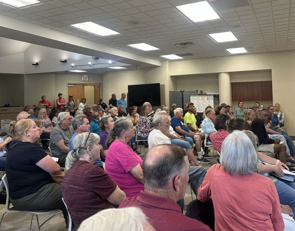 Standing-room-only Oshtemo Township meeting shows residents are organizing against the proposed S. Van Kal BESS and demanding responsible energy siting, transparency, and protection of rural residential areas.